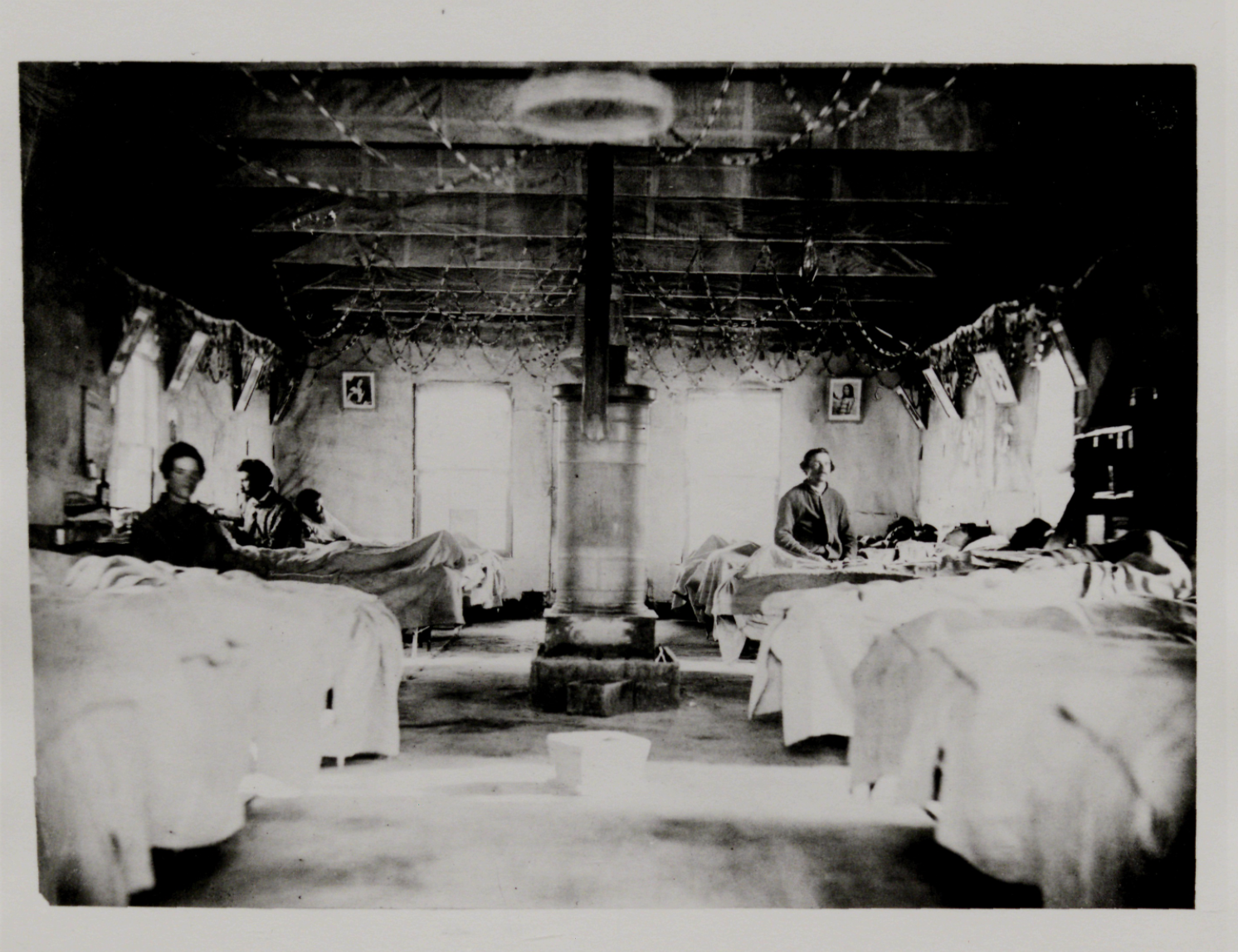 Civil War Rank and File (Black and white photo of Civil War era hospital room with patients in beds and nurses)