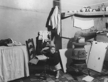 Unidentified child in a Lower East Side tenement, c. 1935-37. (Photograph by Arnold Eagle, Collection of the Lower East Side Tenement Museum © 2009) Unidentified child in a Lower East Side tenement, c. 1935-37. (Photograph by Arn