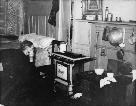 Unidentified woman in a Lower East Side tenement, c. 1935-37. (Photograph by Arnold Eagle, Collection of the Lower East Side Tenement Museum © 2009) Unidentified woman in a Lower East Side tenement, c. 1935-37. (Photograph by Arn