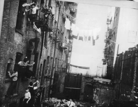 Children climbing on a tenement fire escape, c. 1935-37. (Photograph by Arnold Eagle, Collection of the Lower East Side Tenement Museum © 2009) Children climbing on a tenement fire escape, c. 1935-37. (Photograph by Arnold E