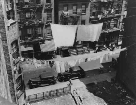 Street seen through a clothesline, c. 1935-37. (Photograph by Arnold Eagle, Collection of the Lower East Side Tenement Museum © 2009) Street seen through a clothesline, c. 1935-37. (Photograph by Arnold Eagle, Coll
