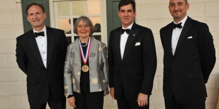 Winner Pauline Maier, with her prize medal, poses with Supreme Court Justice Samuel Alito.