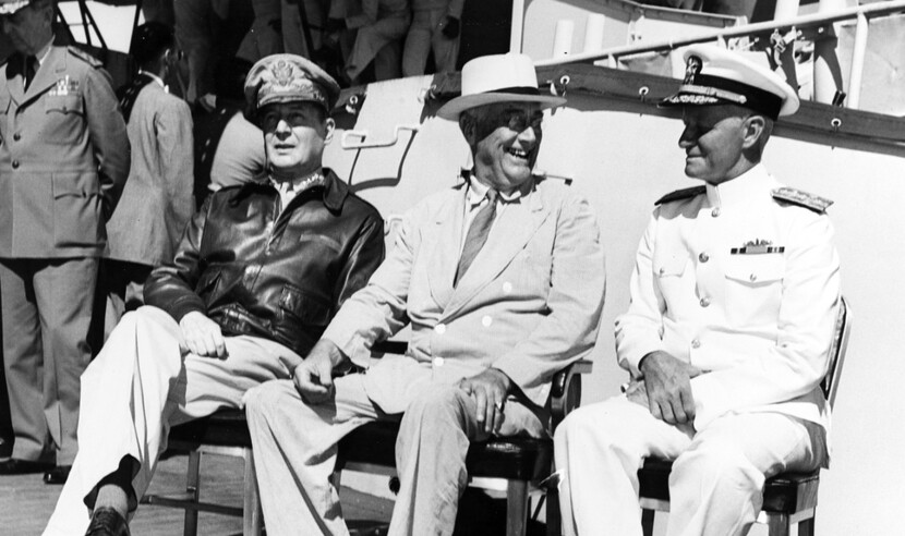 On board USS Baltimore (CA-68), at Pearl Harbor, Hawaii, 26 July 1944. Admiral William D. Leahy, the President's Chief of Staff, is standing in the left background. Official U.S. Navy Photograph, now in the collections of the National Archives