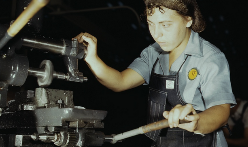Photograph of a Latina worker at a machine