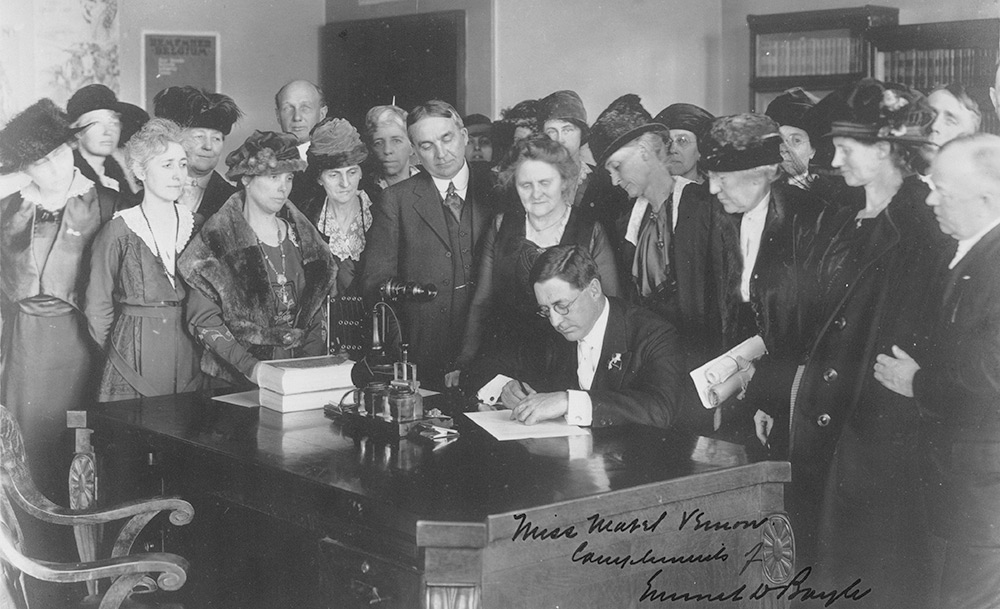 Governor Emmett D. Boyle of Nevada signing the resolution for ratification of the Nineteenth Amendment surrounded by a group of suffragist women, Carson City, Nevada, February 7, 1920. (Prints and Photographs Division, Library of Congress)