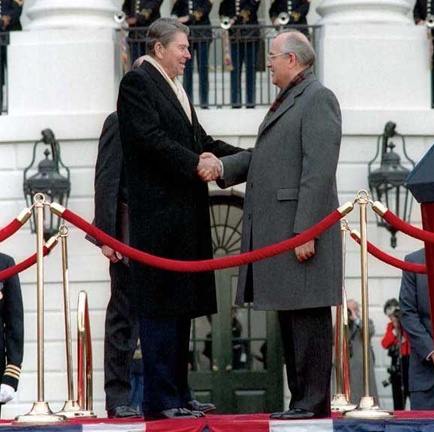 The Global Cold War (Ronald Reagan and Mikhail Gorbachev shaking hands outside of the White House)