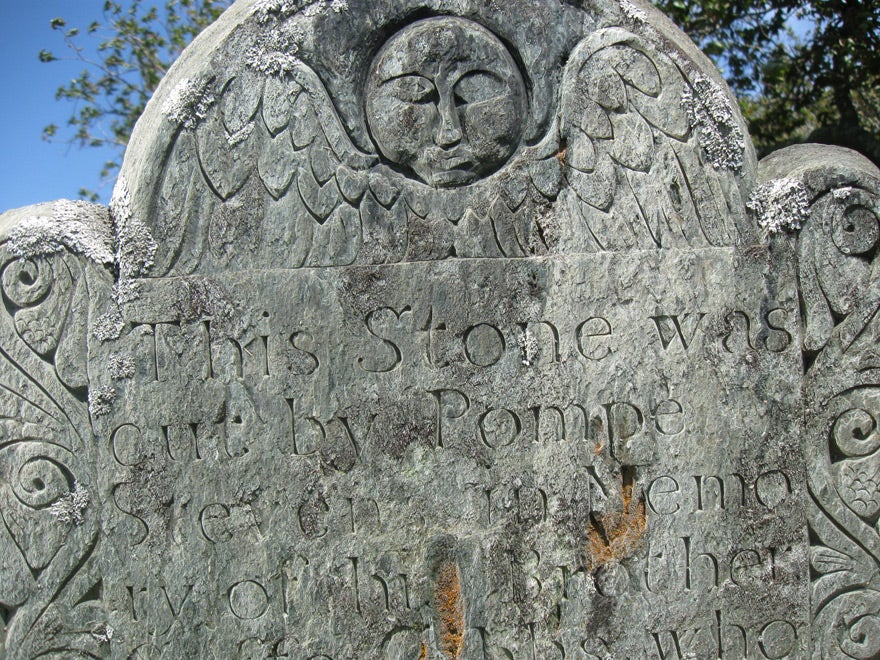 Detail of an eighteenth-century gravestone carved by African American stonecutter Pompe Stevens, God's Little Acre Burial Ground, Newport, Rhode Island (Courtesy of Glenn A. Knoblock)