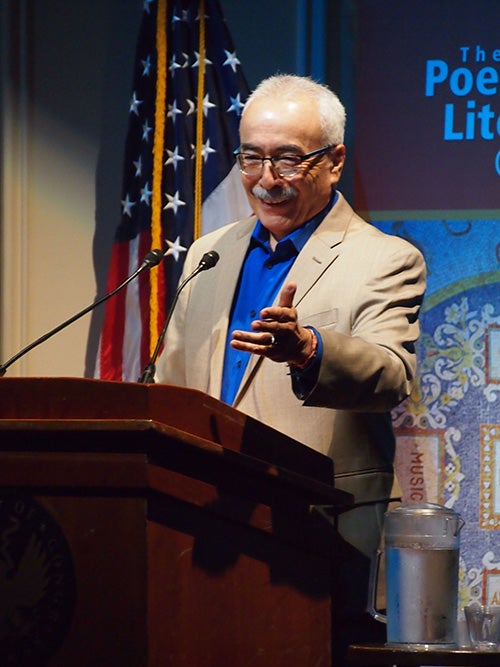 Juan Felipe Herrera reading at the Library of Congress, September 15, 2015. (Photograph by SLOWKING. Wikimedia Commons. CC BY-NC.)