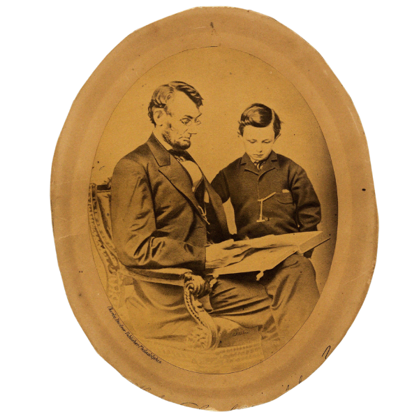Photograph of Abraham and his son Tad Lincoln reading