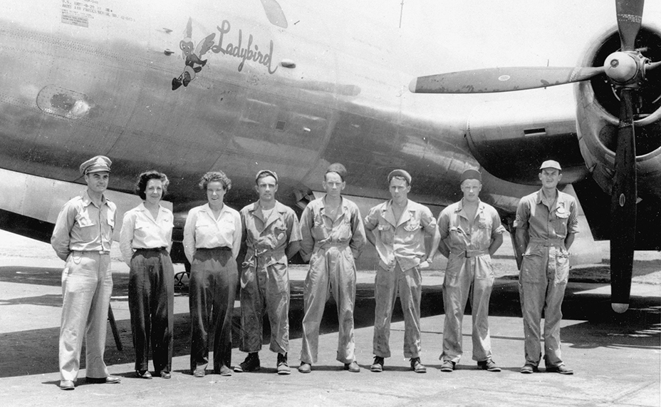 Col. Paul Tibbets, Dorothea Johnson (43-W-4), and Dora Dougherty Strother McKeown (43-W-3) with B-29 crew at Eglin AAB, Fort Walton, Florida, ca. 1944 (Women Airforce Service Pilots – Official Archive, Texas Woman's University)