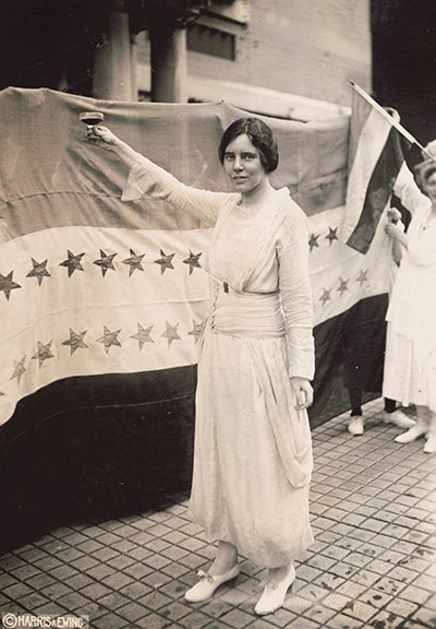 Alice Paul raising a glass to the ratification of the Nineteenth Amendment, ca. September 1920, photograph by Harris & Ewing (Library of Congress)