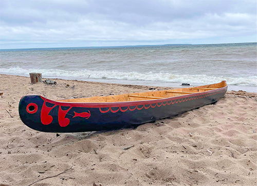 An Ojibwe dugout watercraft, "Gitchigaming Manitowid," or "In the Spirit of Lake Superior," likely one of the first built on Madeline Island since 1854, photograph by Paul DeMain, n.d. (Friends of Madeline Island/Native American Educational Technologies)