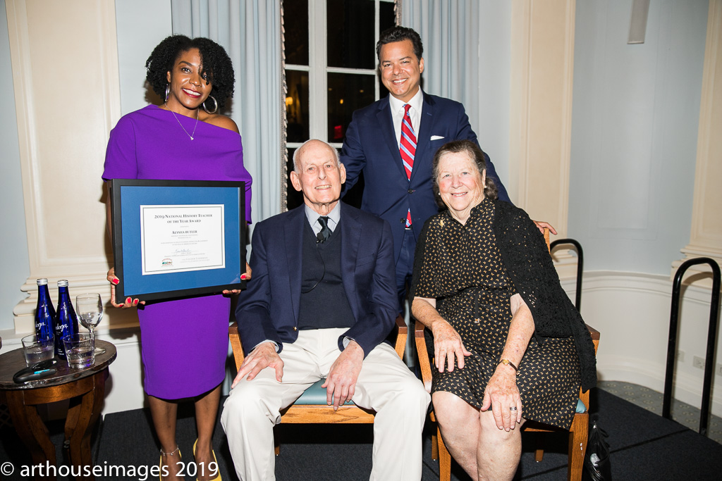 Alysha Butler with CNN Senior Political Analyst John Avlon (standing) and Lewis and Louise Lehrman (seated)