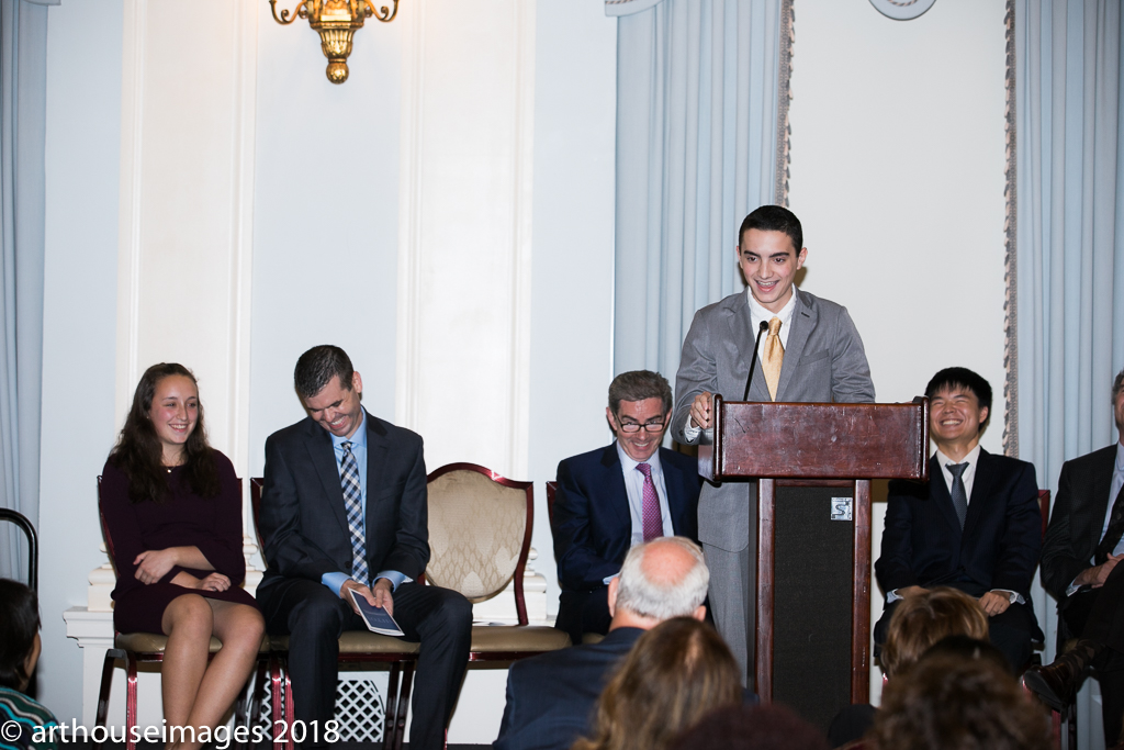 Douglas Bensch speaks while Hannah Sciulli, Joseph Welch, Jim Basker, and Kenny Wong look on.