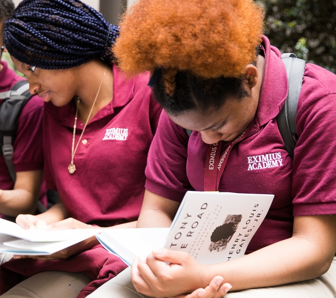 Students from the Eximus Academy, a Gilder Lehrman Affiliate School, pore over their free copies of Professor Gates' newest book.