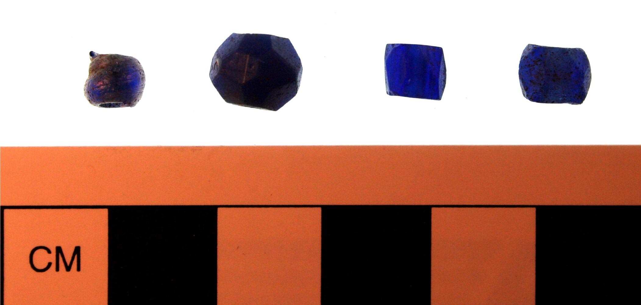 Blue glass trade beads, recovered from Cabin W-12. Many historical archaeologists have interpreted these types of beads, especially cobalt blue examples, as potential charms, worn by enslaved people to ward off malevolent forces. (Courtesy of James M. Davidson)