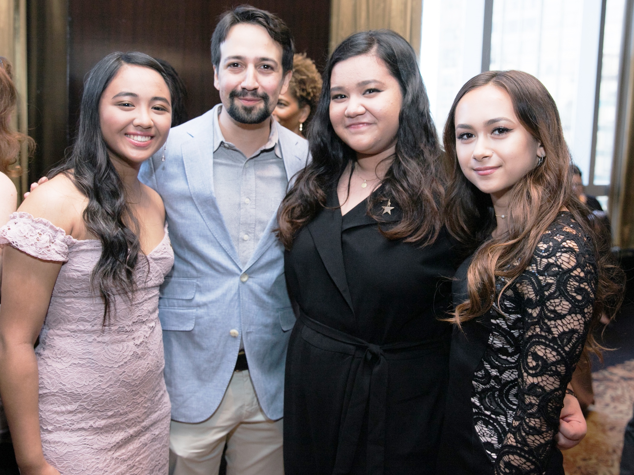 Lin-Manuel Miranda posing with Hamilton Education Student Performers at the 2018 GLI Gala