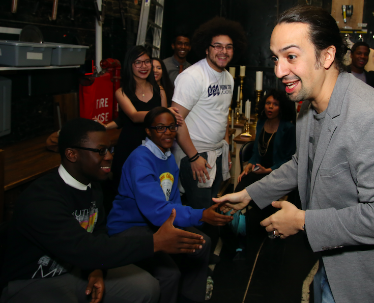 Lin-Manuel Miranda visits student performers backstage in their EduHam Program