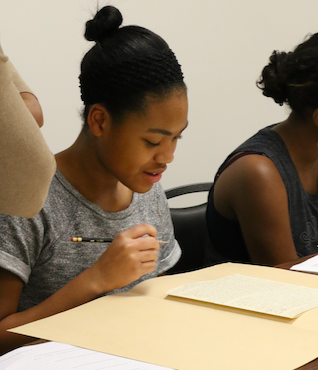 A student works with a document in the Gilder Lehrman Collection.