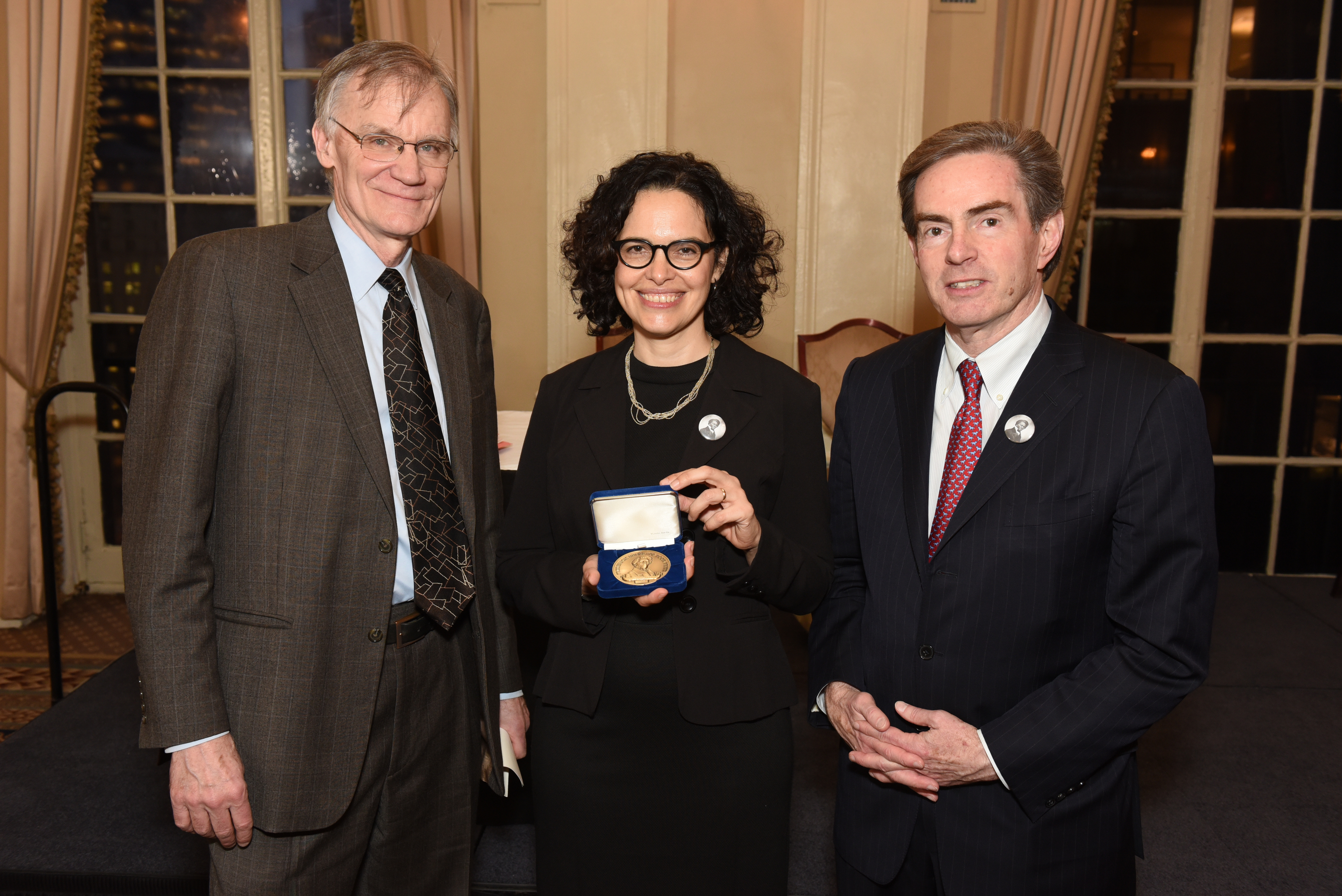 Ada Ferrer holds her award alongside Gilder Lehrman President James Basker and D