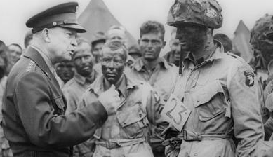 Gen. Eisenhower speaks with paratroopers before they participate in the first as