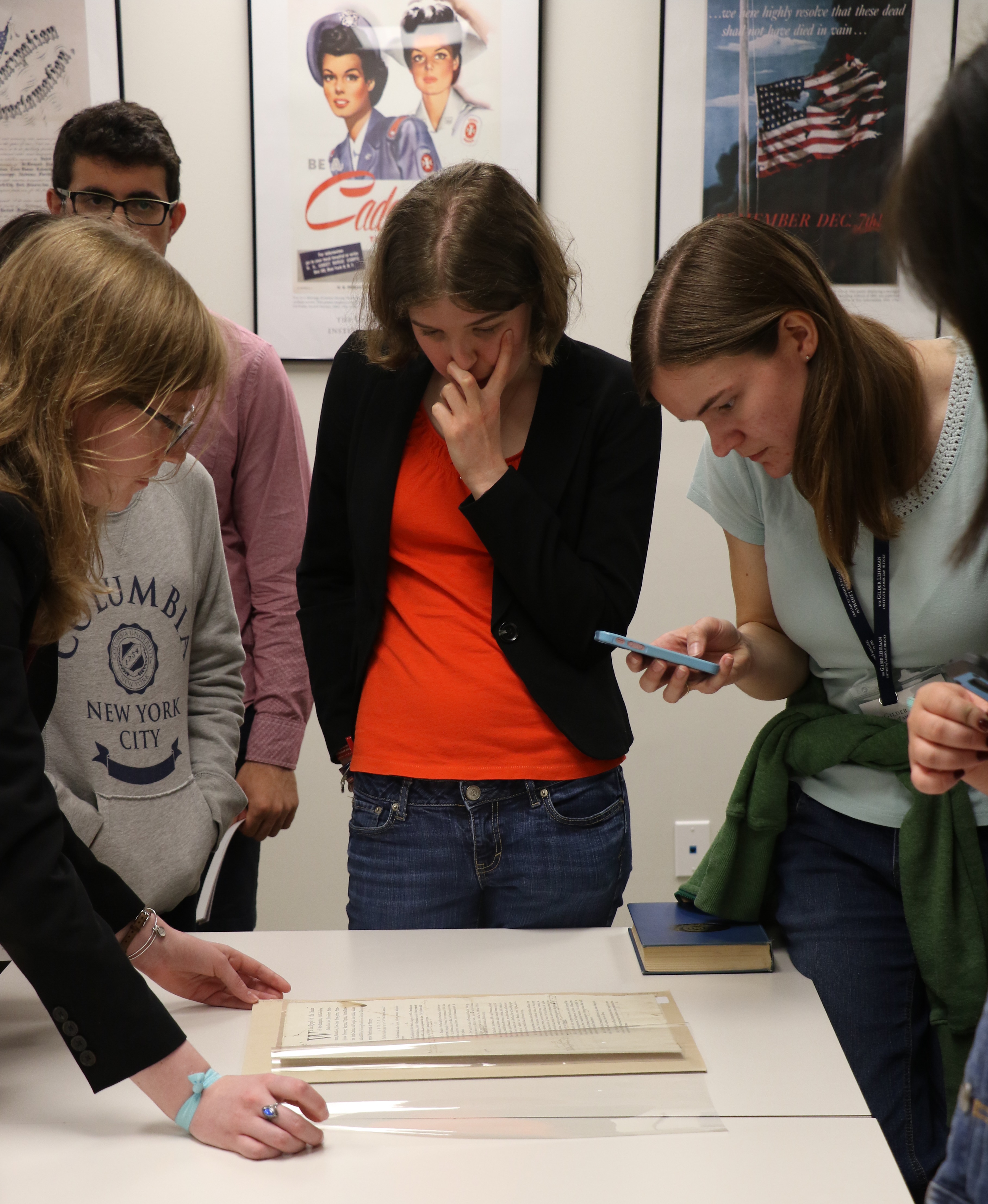 Melanie Sheehan (center) gets a close look at the first draft of the US Constitution at the Gilder Lehrman Collection.