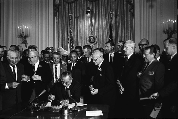 President Lyndon B. Johnson signing the Civil Rights Act into law, July 2, 1964.