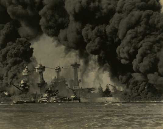 USS West Virginia & USS Tennessee enveloped in clouds of smoke from USS Arizona
