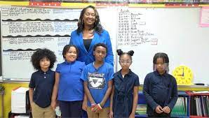 2022 Tennessee History Teacher of the Year Melissa Collins poses with some of her students at John P. Freeman Optional School in Memphis. Courtesy of Memphis-Shelby County Schools