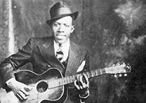 Robert Johnson, portrait by Hooks Bros., Memphis, Tennessee, ca. 1935. (Wikipedia, from www.deltahaze.com) Robert Johnson, portrait by Hooks Bros., Memphis, TN, ca. 1935. (Wikipedia)