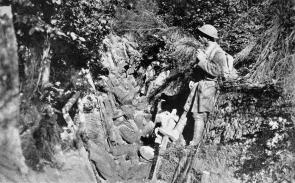 American soldiers rest in a trench in the Argonne Forest, France, 1918. From Col