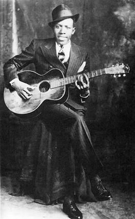 Robert Johnson, portrait by Hooks Bros., Memphis, TN, ca. 1935. (Wikipedia)