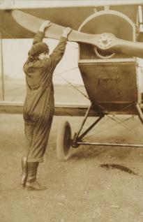 Neta Snook with plane, ca. 1920 (GLC07243.006.03)