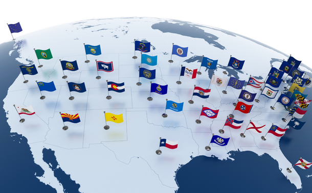 Map of the United States with each state's flag standing over its state