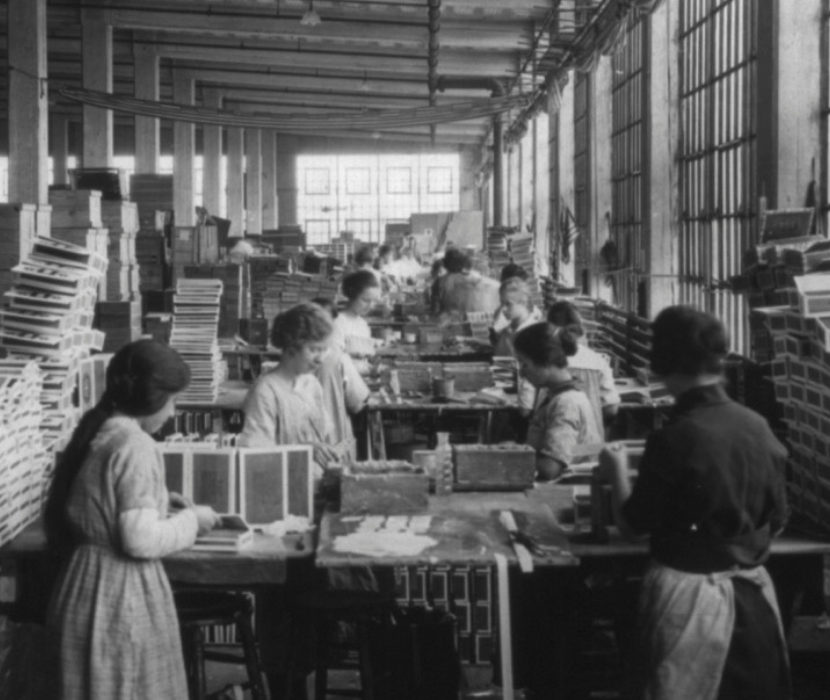 Detail from black and white photograph showing women working in a wooden box factory