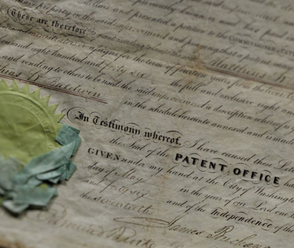 Detail from an official patent concerning the combination of the steam whistle and the boiler, with a partial view of the seal. The patent is largely printed but certain parts have been filled in by hand.
