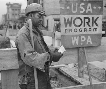 Photo showing WPA worker receiving a paycheck with sign in background "USA Work Program WPA"
