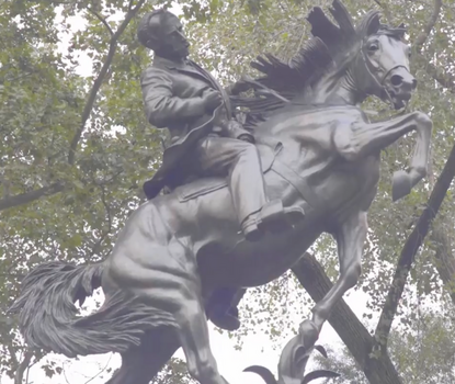 View of statue with a rider on a horse in frenzied movement