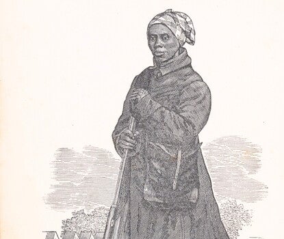 A woodcut of a Black woman wearing a dark coat, long striped dress, and headscarf, holding a rifle with a satchel over her shoulder and military tents in the background.