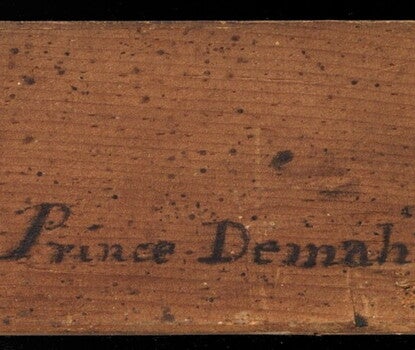 Prince Demah’s name written on the wooden stretcher of a painting