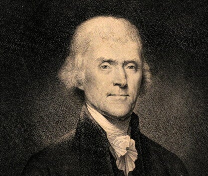 An engraving of President Thomas Jefferson, a White man with white hair, wearing a white shirt and dark jacket.