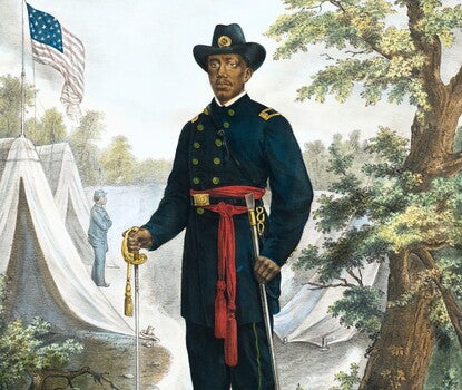 Color print of a Black Union soldier in uniform (blue wide brimmed hat with an emblem, blue double-breasted coat with a black belt and gold US belt buckle and red sashes, blue pants, black shoes), holding a sword in his right hand and its sheath in his left; a large American flag flies over his head and there are military tents and a Black soldier in the background.