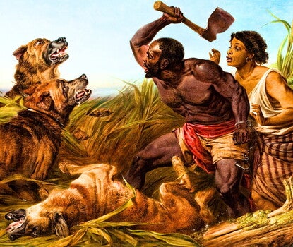 This oil painting depicts a fugitive enslaved man and woman beset by three mastiff dogs in a marshy landscape. The man crouches between the dogs and the woman, wielding a hatchet in his upraised right hand. Dangling from his clenched left wrist is a pair of manacles, with one cuff broken open. His body has numerous scars and a round brand or tattoo on his left shoulder. The woman is crouched behind him, both arms raised to shoulder height, palms faced outward as she peers over the man's shoulder. The dogs a