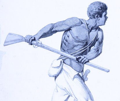 A shirtless and shoeless Black man wearing white pants and a sword along his right leg while brandishing a rifle with both hands and identified as "Leonard Parkinson, a Captain of the Maroons."