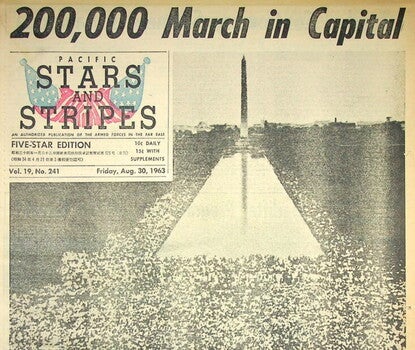Scan of the front page of the Pacific Stars and Stripes Newspaper from August 30, 1963, featuring a large image of the 1963 March on Washington. 
