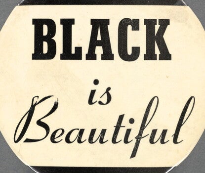 A button reading "Black is Beautiful," with black text on a white background.