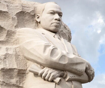 Photograph of large sculpture of Martin Luther King Jr. carved out of stone. 