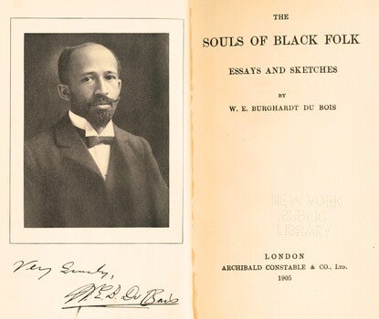Frontispiece and title page of The Souls of Black Folk, with a photograph of the author, a Black man with a mustache and beard, signed by W. E. B. Du Bois at the bottom left.