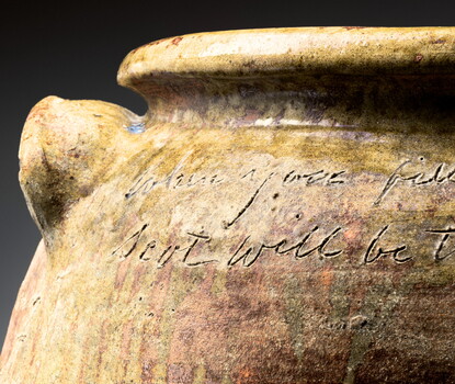 Inscription on a dark brown earthenware jar, reading:  "this jar is to Mr Segler who keeps the bar in orangeburg / for Mr Edwards a Gentle man — who formly kept / Mr thos bacons horses / April 21 1858" "when you fill this Jar with pork or beef / Scot will be there; to get a peace, - / Dave"