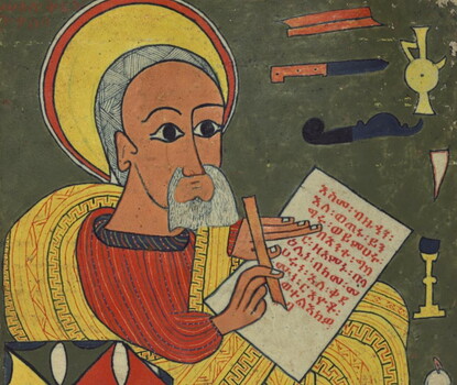A color illustration of an olive-skinned, gray-haired/bearded St. Luke (with ceremonial halo) writing in Ge'ez.